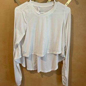 Free people workout high low top like new has finer holes in sleeves!